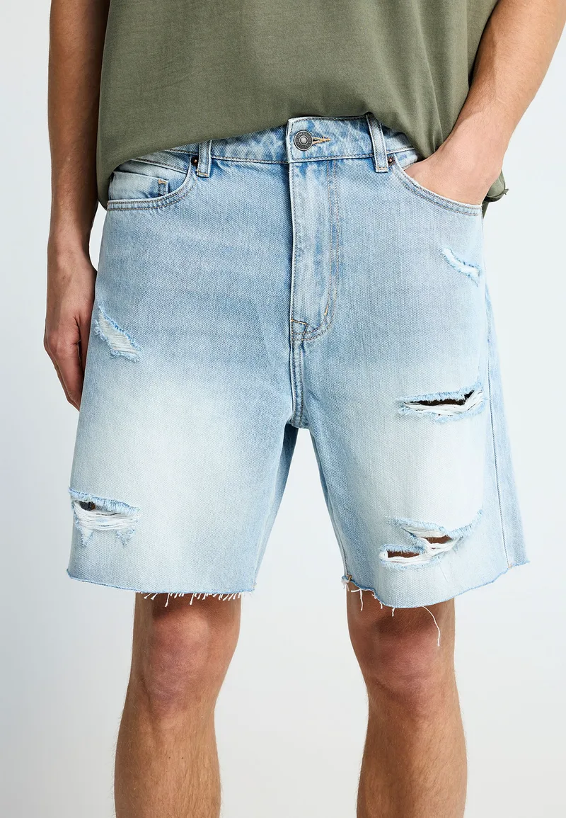Ανδρική baggy βερμούδα τζην με destroyed effects